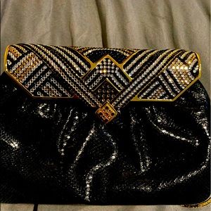 Snake/rhinestone clutch handbag with gold strap. Mirror and comb included.